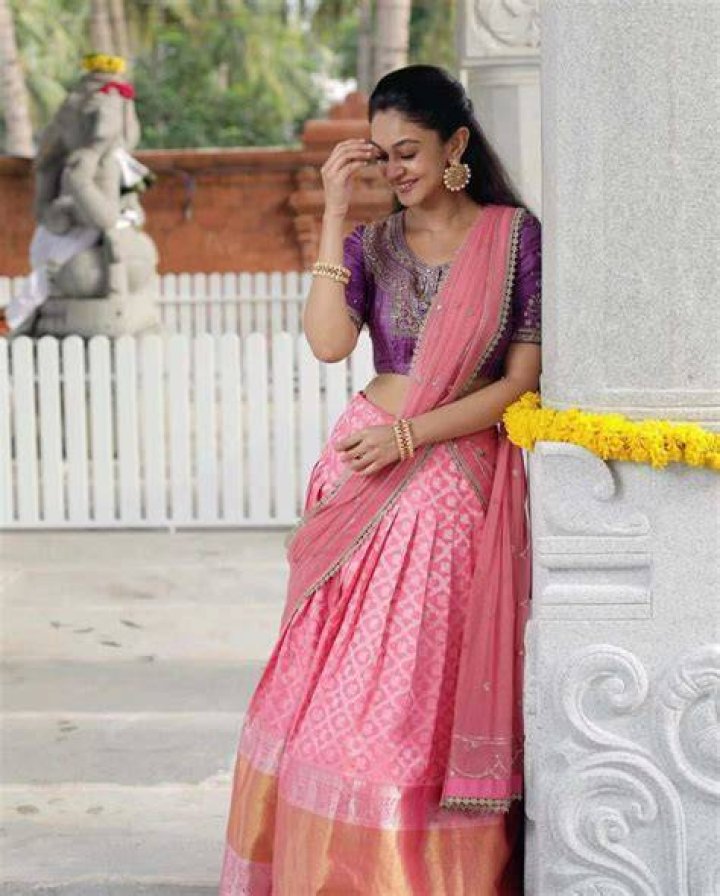 Aishwarya Arjun in Bhargavi kunam Pink Lehenga for her family temple
