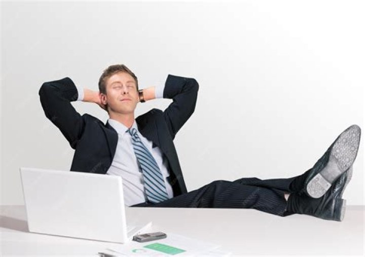 Businessman day dreaming on a wheelchair Stock Photo Alamy