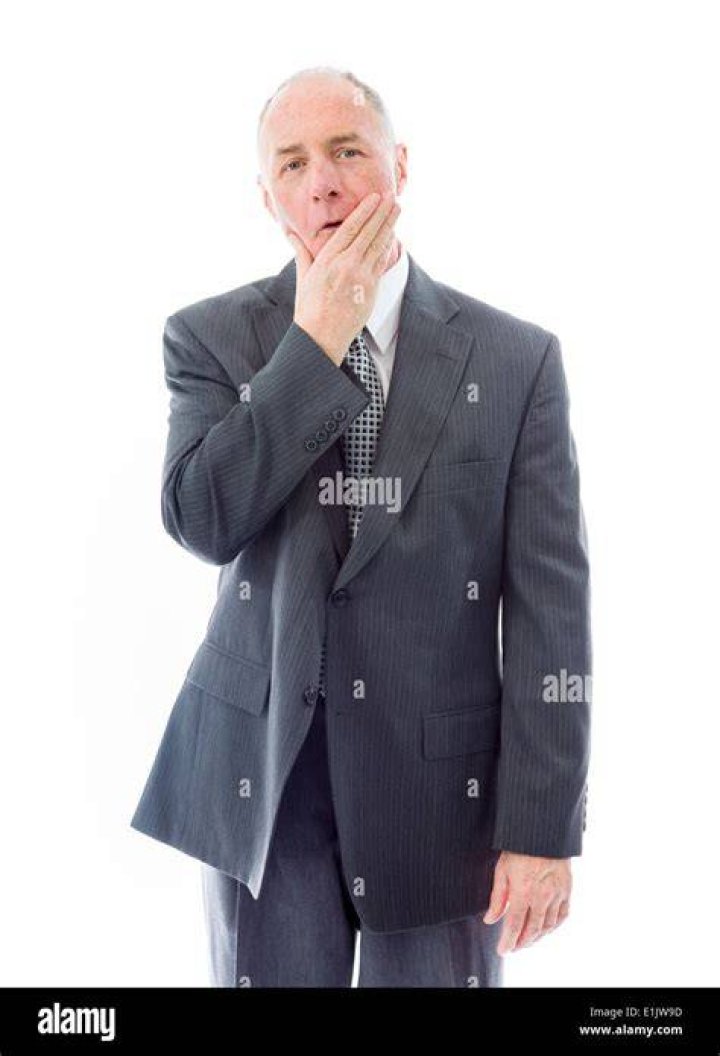 Businessman looking shocked Stock Photo Alamy