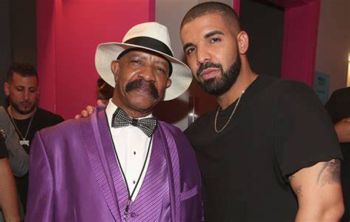Drake pranked by his dad as a giant pink bra is thrown on stage