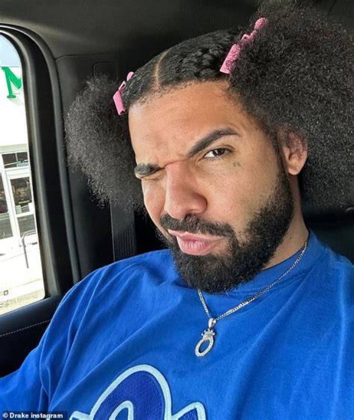 Drake wears his natural hair while partying late into the night in West