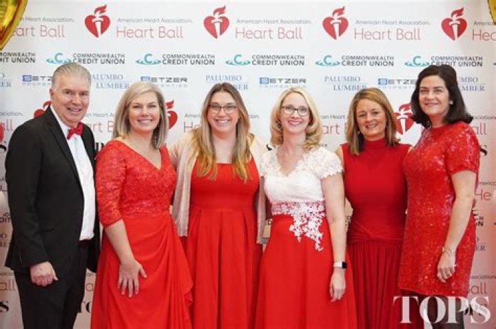 Heart Ball honoree Amy Tarkanian holding a Michael E Minden custommade