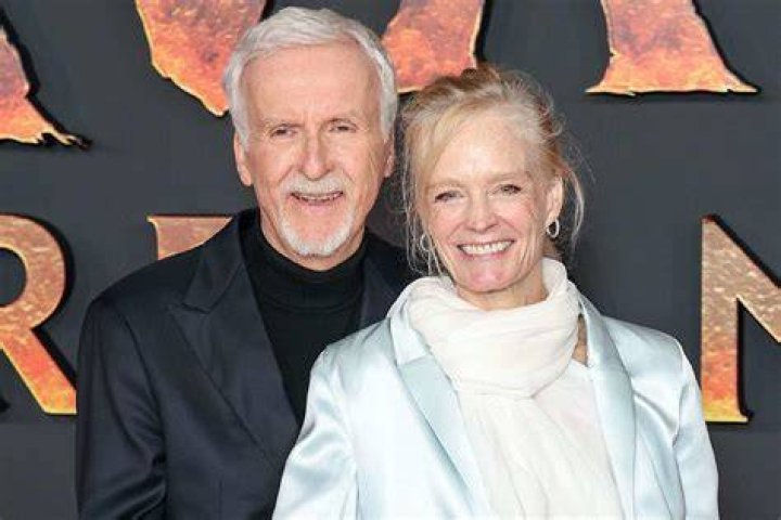 James Cameron with wife Suzy Amos and daughter and son arriving at the