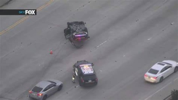 Moment bungling cop flips over bike's handlebars as he chases suspect