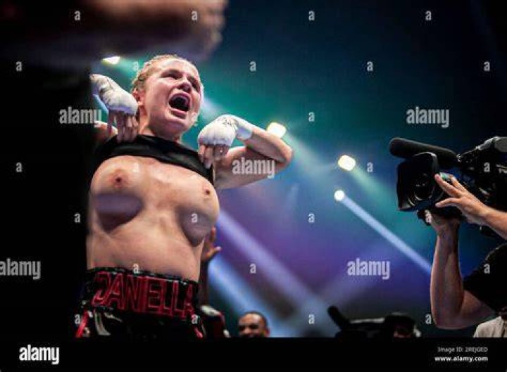 OnlyFans boxer Daniella Hemsley flashes boobs after winning fight as