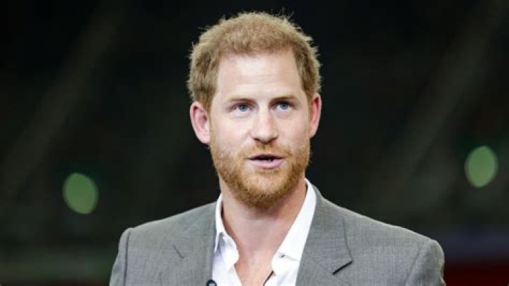 Prince Harry Looks in Awe of Bryan Adams' Wounded Exhibition Photo