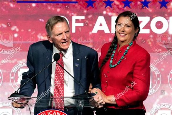 Rep. Paul Gosar, left, RAriz., speaks as his wife Maude Gosar, right