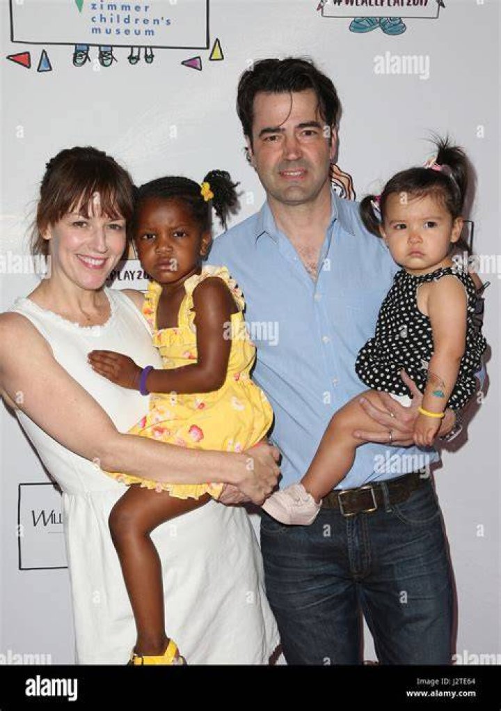 Ron Livingston and Rosemarie DeWitt bond with their daughter Gracie